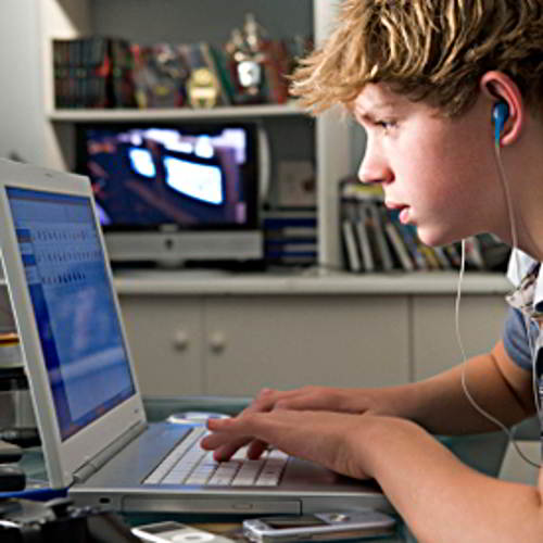 Boy in front of laptop